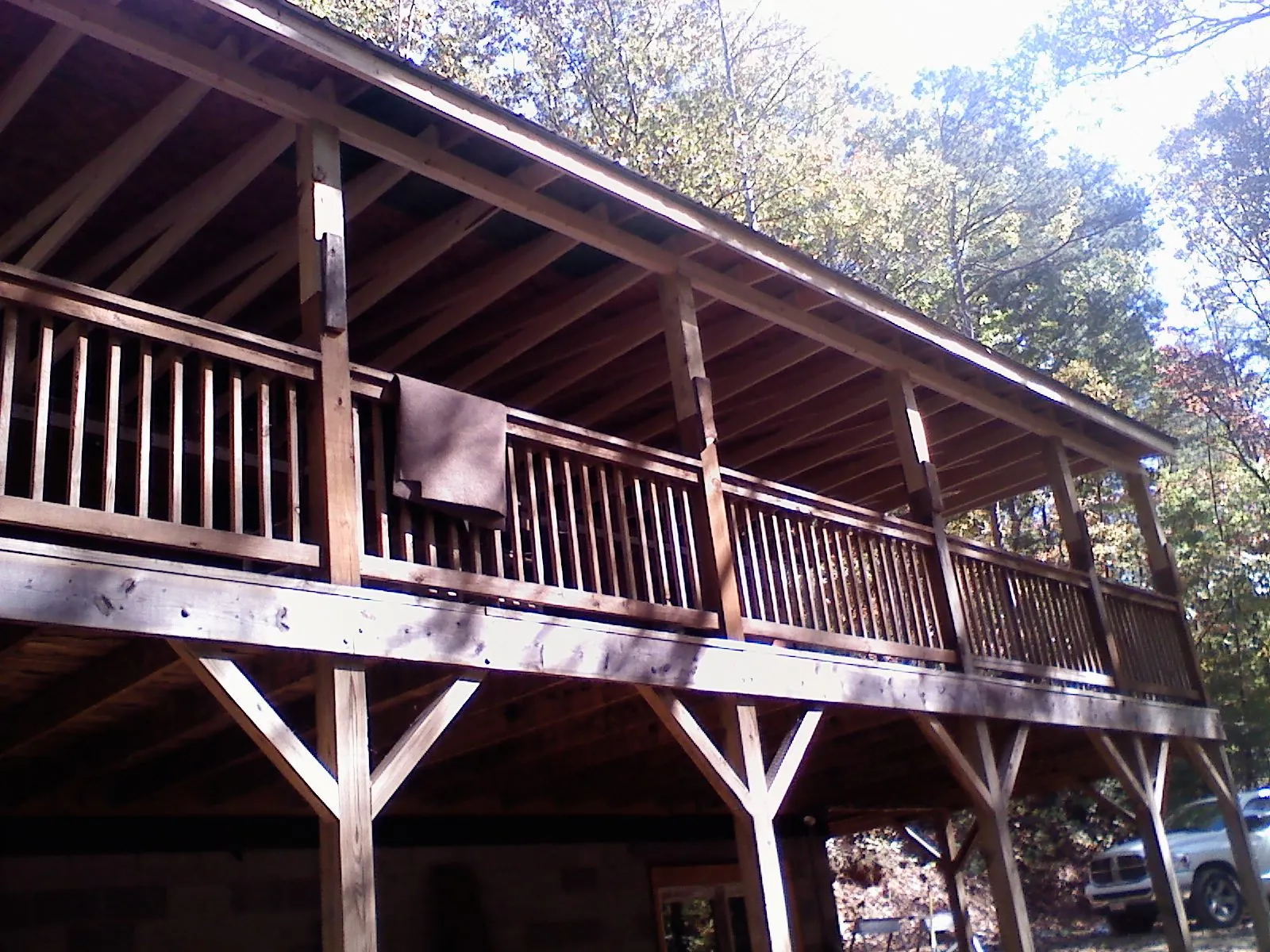 Timber framing under a new elevated porch and deck — Roof Leak Repair in State Farm by Roofing Brothers